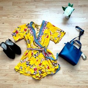 Flowy romper with tie for easy cinch at the waist. Loose shorts for comfort.